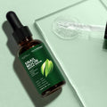 Snail mucin brightening serum bottle